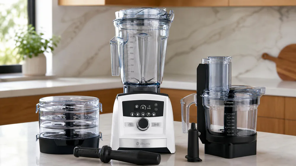 The Vitamix A3500 SmartPrep processor open, with its four discs stacked in the storage case.