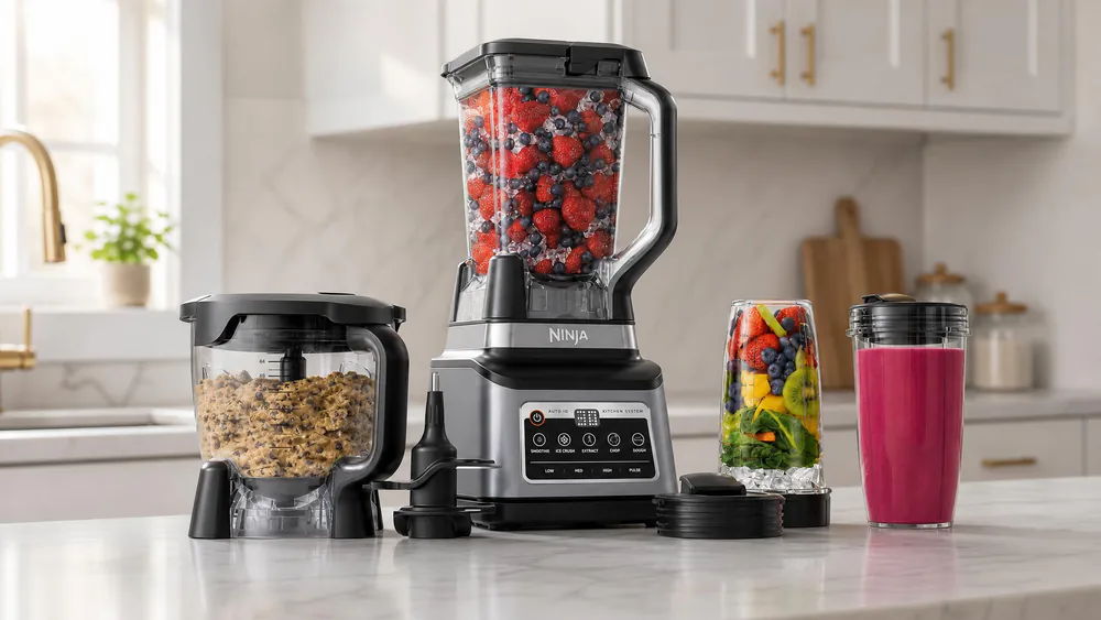 The Ninja BN801 Professional Plus Kitchen System on a counter, its pitcher, bowl, and cups arranged around the base.