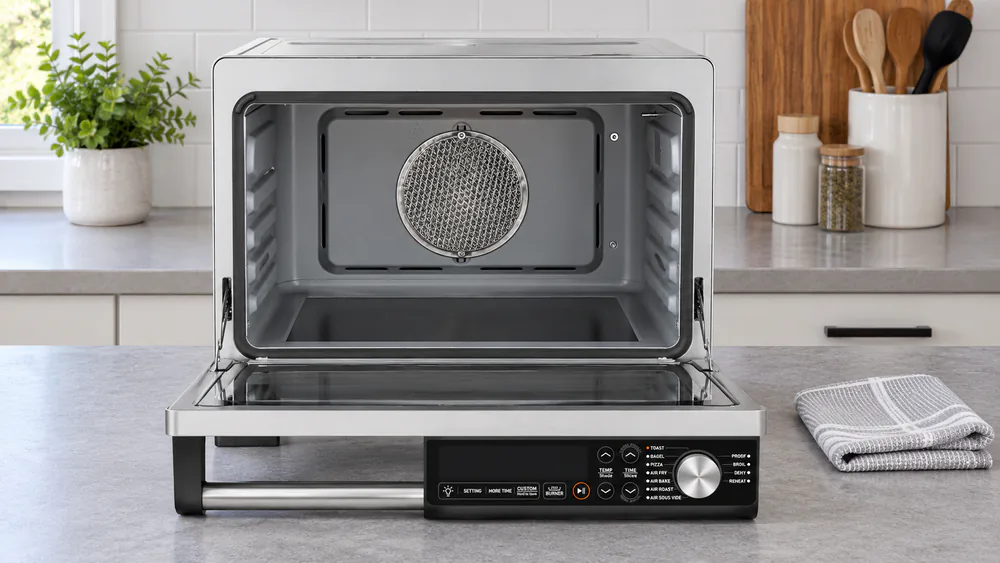 The interior of a Cosori 26-quart ceramic toaster oven with flat ceramic elements wiped clean after a melted-cheese bake