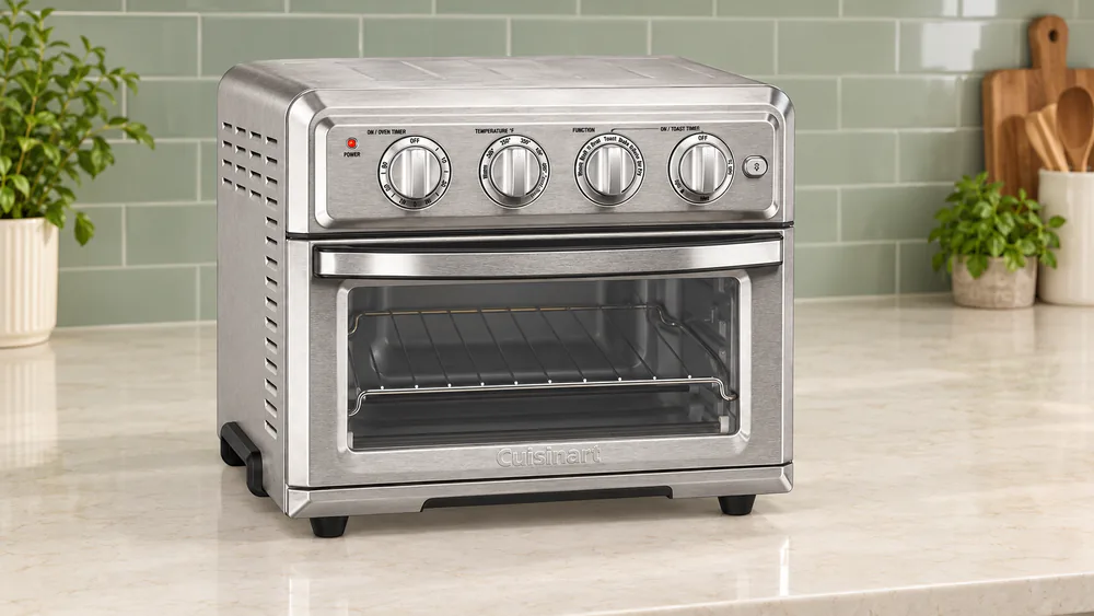 Cuisinart TOA-60 air fryer toaster oven with four control dials on a kitchen counter
