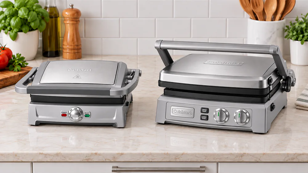 A Cuisinart Griddler Compact next to a larger GR-150 on a kitchen counter to show the difference in footprint