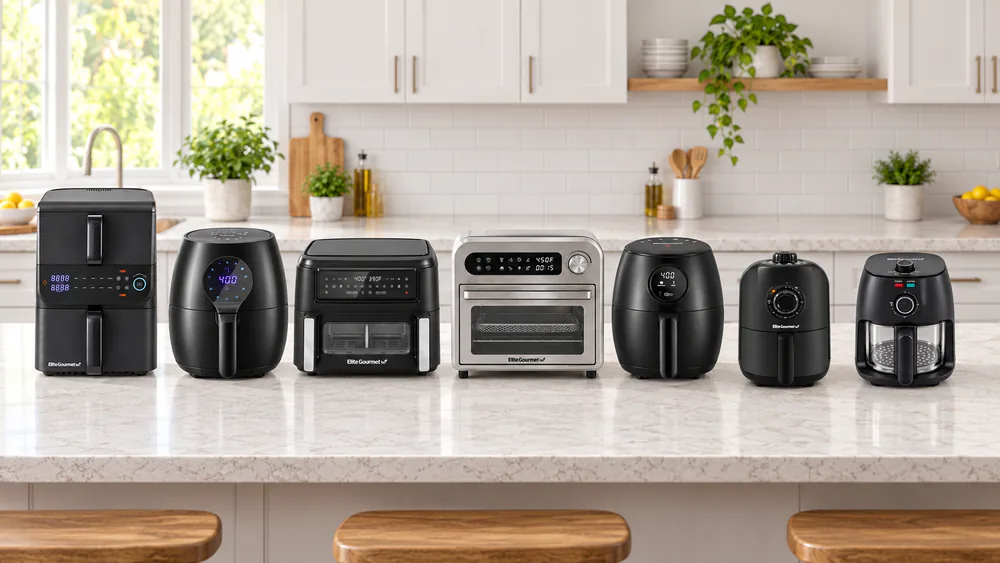 Seven Elite Gourmet air fryers lined up on a kitchen counter, from a 1.1 Qt personal model to an 11 Qt dual zone