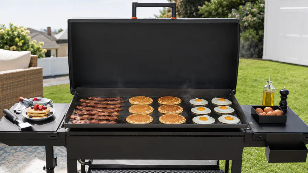 Bacon, pancakes, and fried eggs on the pre-seasoned cold-rolled steel top of the Camp Chef Gridiron 36.