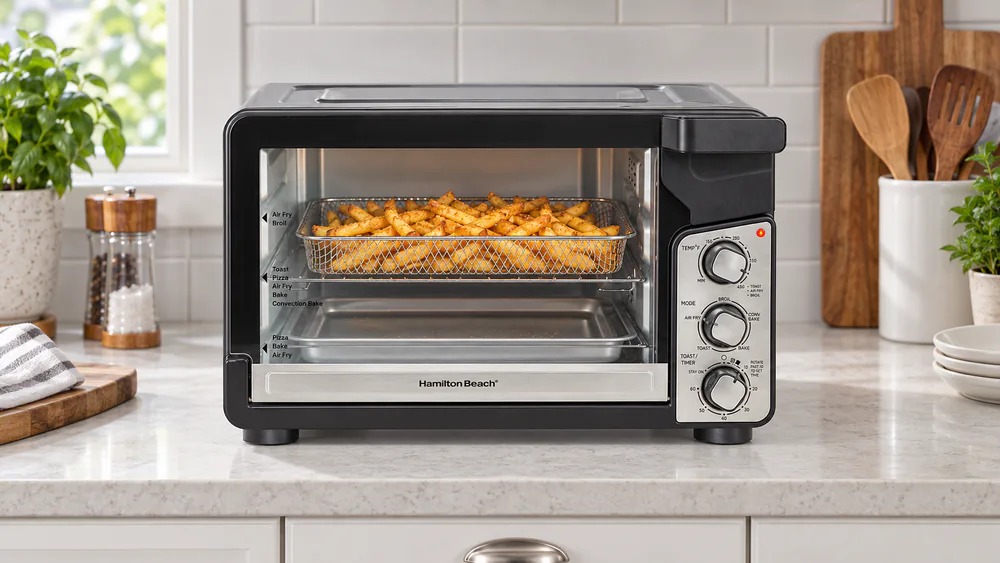 Hamilton Beach Easy View XL oven with its large glass window showing a tray of fries browning inside