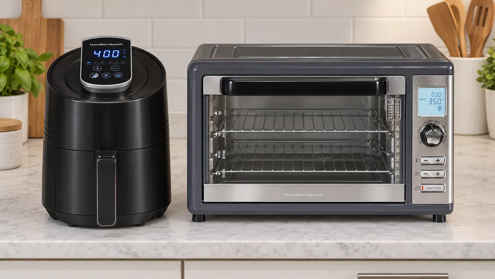 A 3.7 qt Hamilton Beach basket air fryer next to a Sure-Crisp XL oven on a kitchen counter to show the size difference