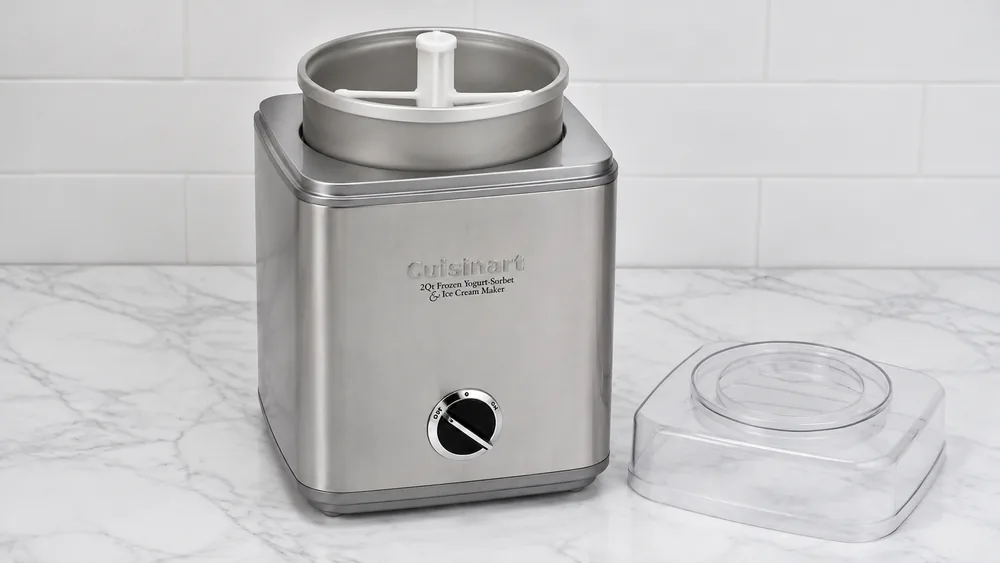 The 2-quart double-insulated freezer bowl of a Cuisinart ICE-30BCP1 resting in the base with the mixing paddle seated.