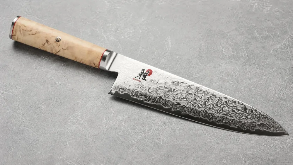 The Miyabi Birchwood SG2 showing the Karelian birch handle and its Damascus blade.