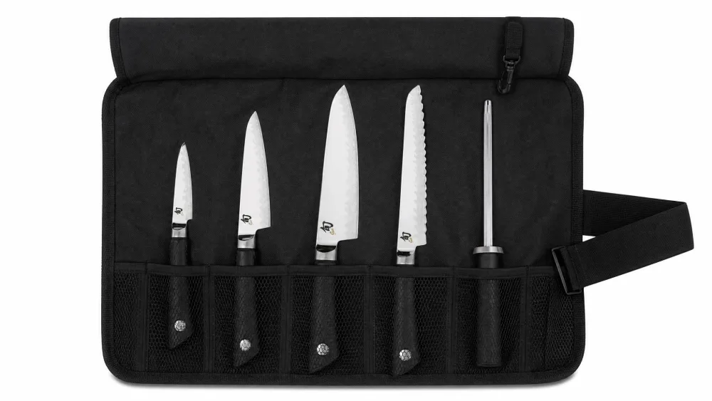 The Shun Sora 5-piece set packed in its 8-slot nylon knife roll, textured handles visible through the slots.