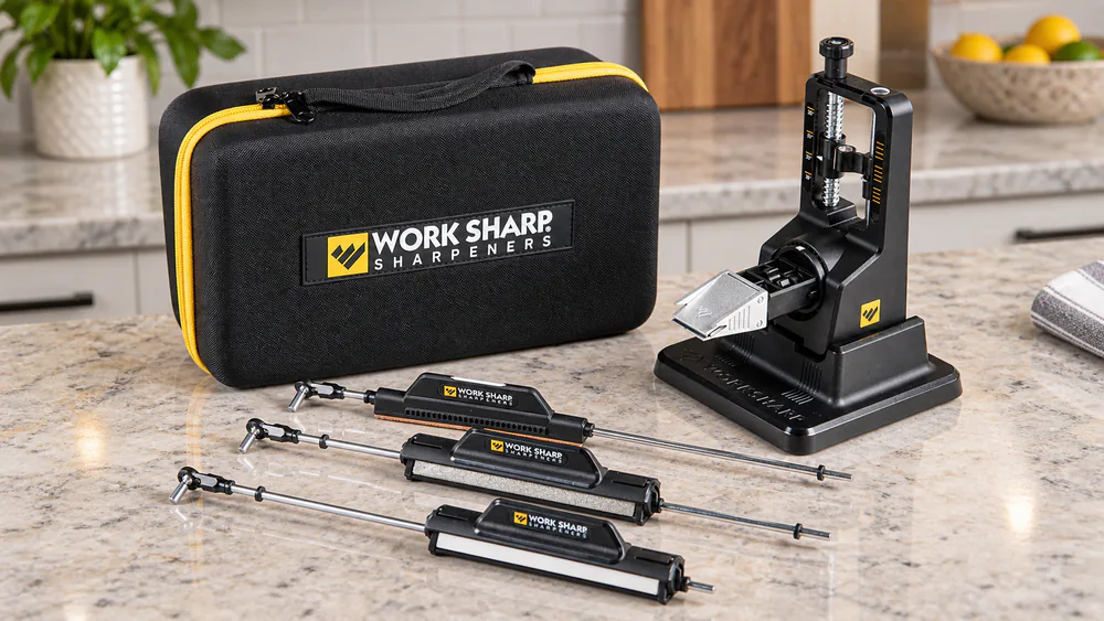 The Work Sharp Precision Adjust Elite with its two Tri-Brasive rods and serrated-blade rod laid out on a kitchen counter.