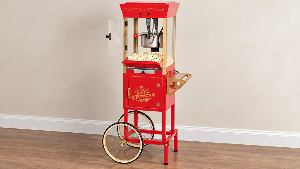 Red Nostalgia Professional popcorn machine, stainless kettle visible through tempered glass.