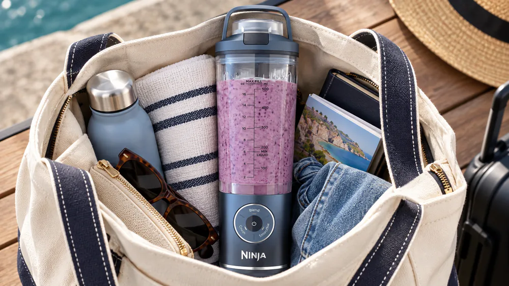 A Ninja Blast Max standing upright in a packed tote bag with its sip lid closed, no leaks around the seal.