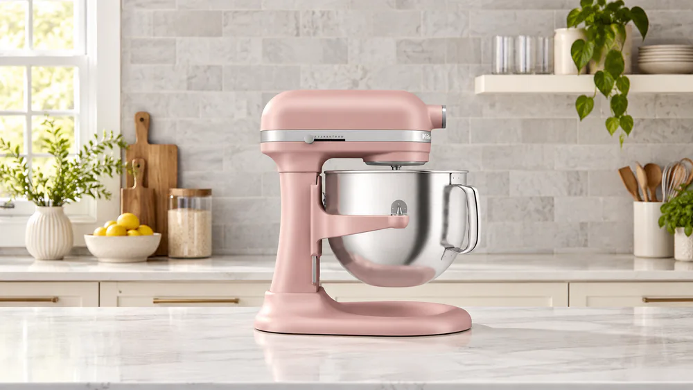 A KitchenAid 7-quart bowl-lift mixer with the bowl raised and locked on its supports, with the flat beater attached inside