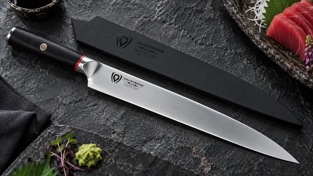 A DALSTRONG Phantom yanagiba with mirror-polished blade resting in its polymer DragonLock saya.