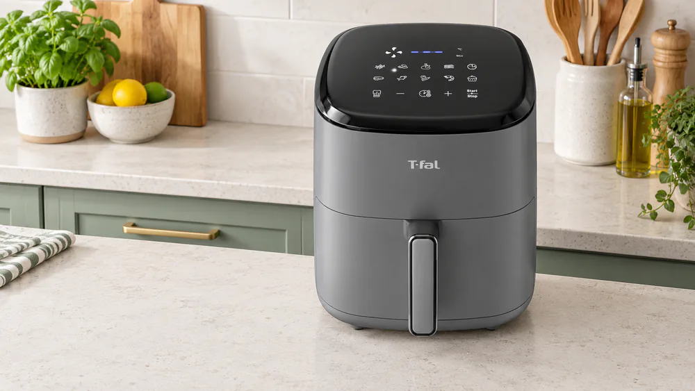 The digital touchscreen of a T-fal Easy Fry Max 5.3 qt air fryer lit up with its ten cooking presets on a kitchen counter