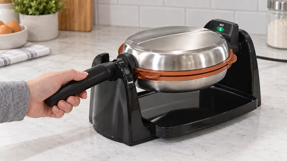 Hamilton Beach Easy Flip 26031 turned 180 degrees on its base, a thick Belgian waffle baking inside