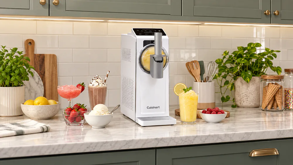 Tall Cuisinart ICE-200 positioned beneath kitchen cabinets to show its narrow width and deep countertop footprint.