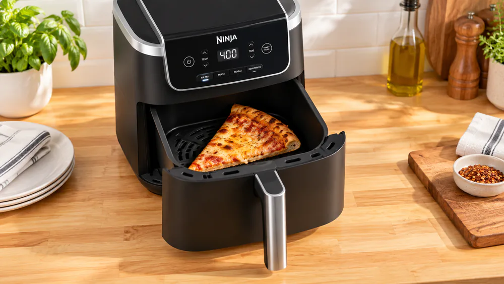 A slice of leftover pizza reheated in the Ninja AF141, with a crisp crust.