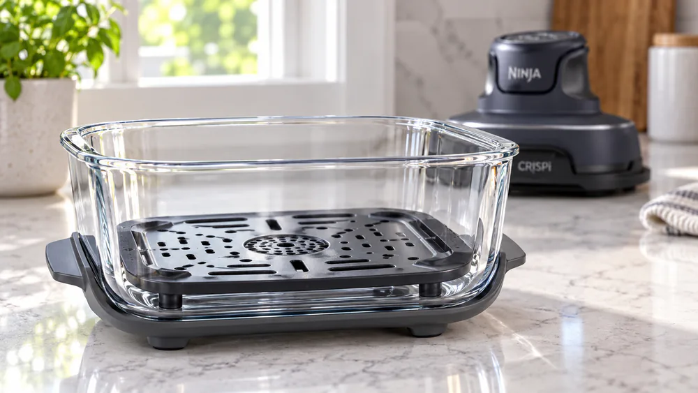 Close-up of the glass container wall and the ceramic-coated crisper plate inside.