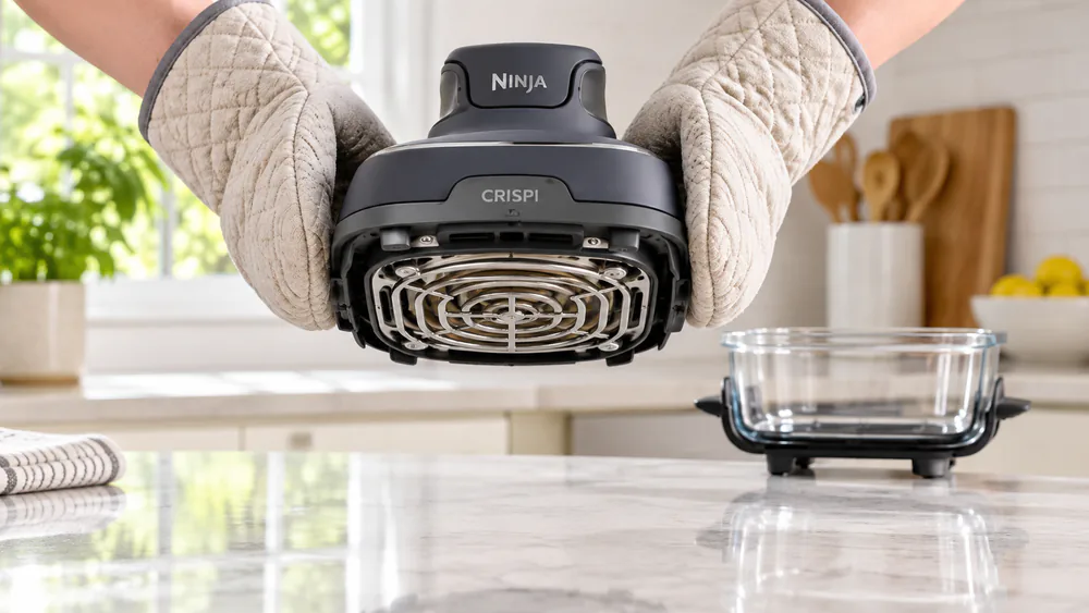The Ninja Crispi PowerPod with its exposed heating element above the counter.
