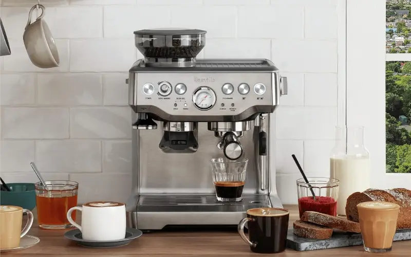 Breville BES870XL Barista Express espresso machine with built-in grinder brewing fresh espresso at home
