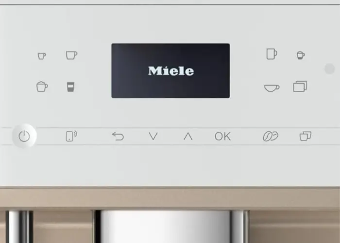 Miele CM 6360 coffee machine control panel showing display screen and touch icons for drink selection and settings.